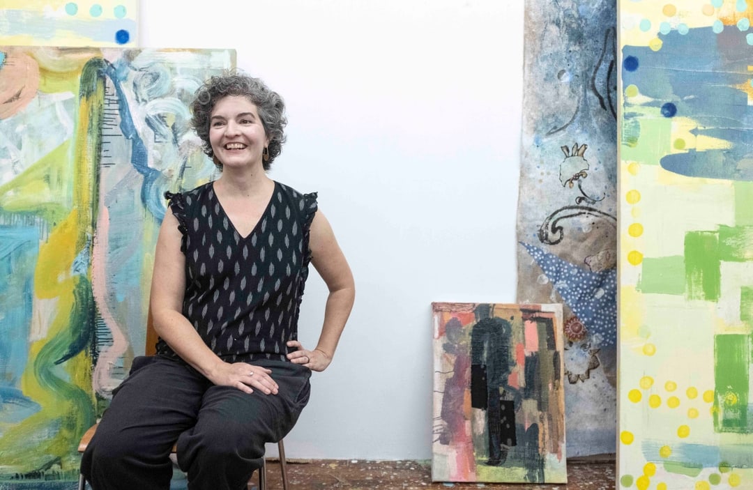 Artist Molly Herman sitting in her art studio in Brooklyn New York
