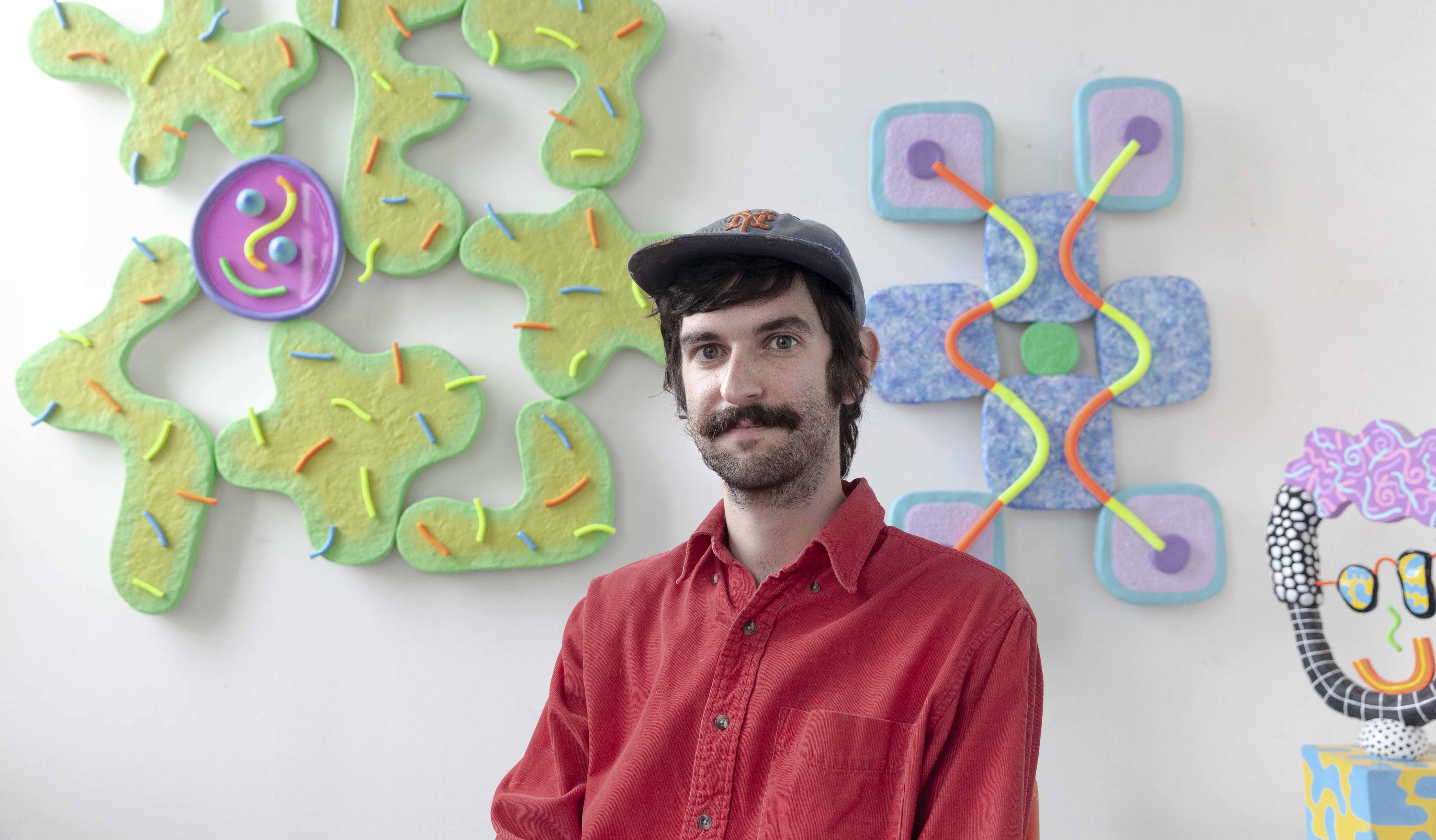 abstract sculpture artist Ryan Patrick Martin sitting in his studio in Brooklyn New York