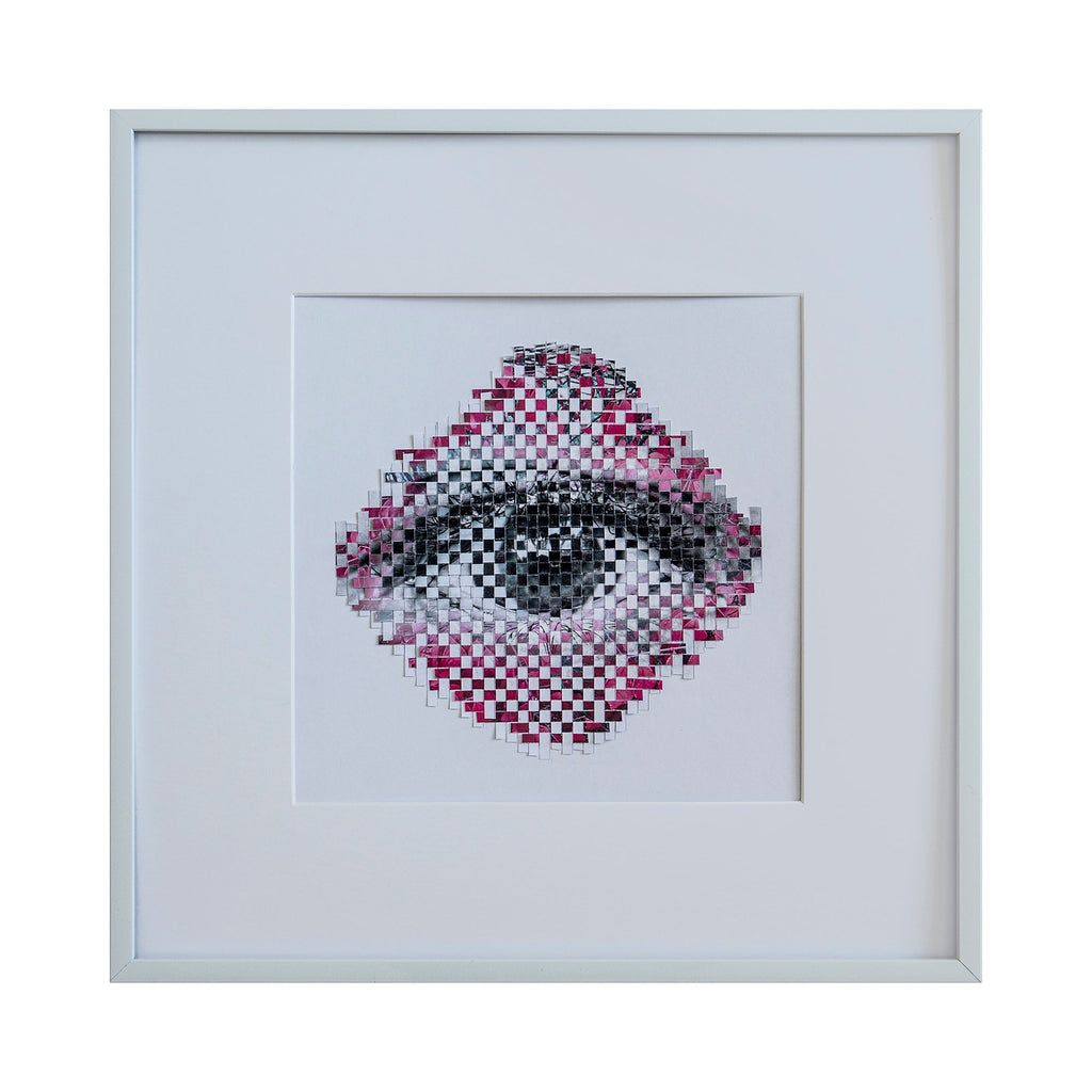 The artwork 'Pink Leaves' by Kiana Honarmand features a pixelated eye design rendered in black, gray, and pink tones. The digital print is hand-cut and woven, creating a mosaic-like pattern where pink pixels radiate outward from a central detailed eye motif. The piece is presented in a minimalist white frame, measuring 16x16 inches. The geometric composition blends traditional weaving techniques with modern digital art. By Kiana Honarmand.