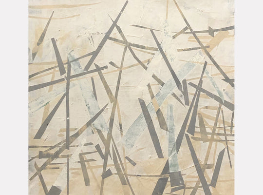 The artwork 'Pale Out' by Shira Toren features intersecting geometric lines in muted gray and brown tones against a creamy beige background. Abstract angular strokes create a dynamic composition reminiscent of scattered matchsticks or fallen branches. The 24x24 inch print employs a minimalist aesthetic with layered translucent elements creating depth and movement.