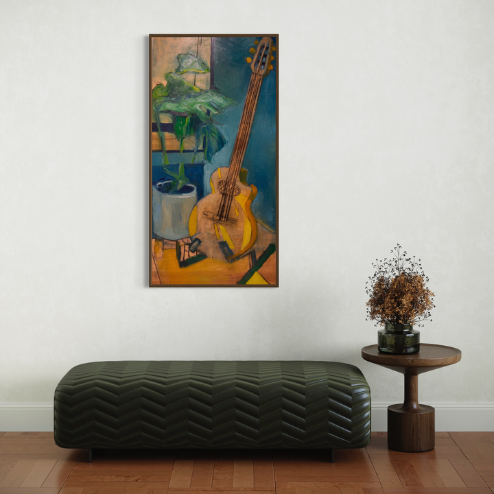 A photo of the artwork c'est ne pas une guitare, by Darren Singer, hanging on a wall.