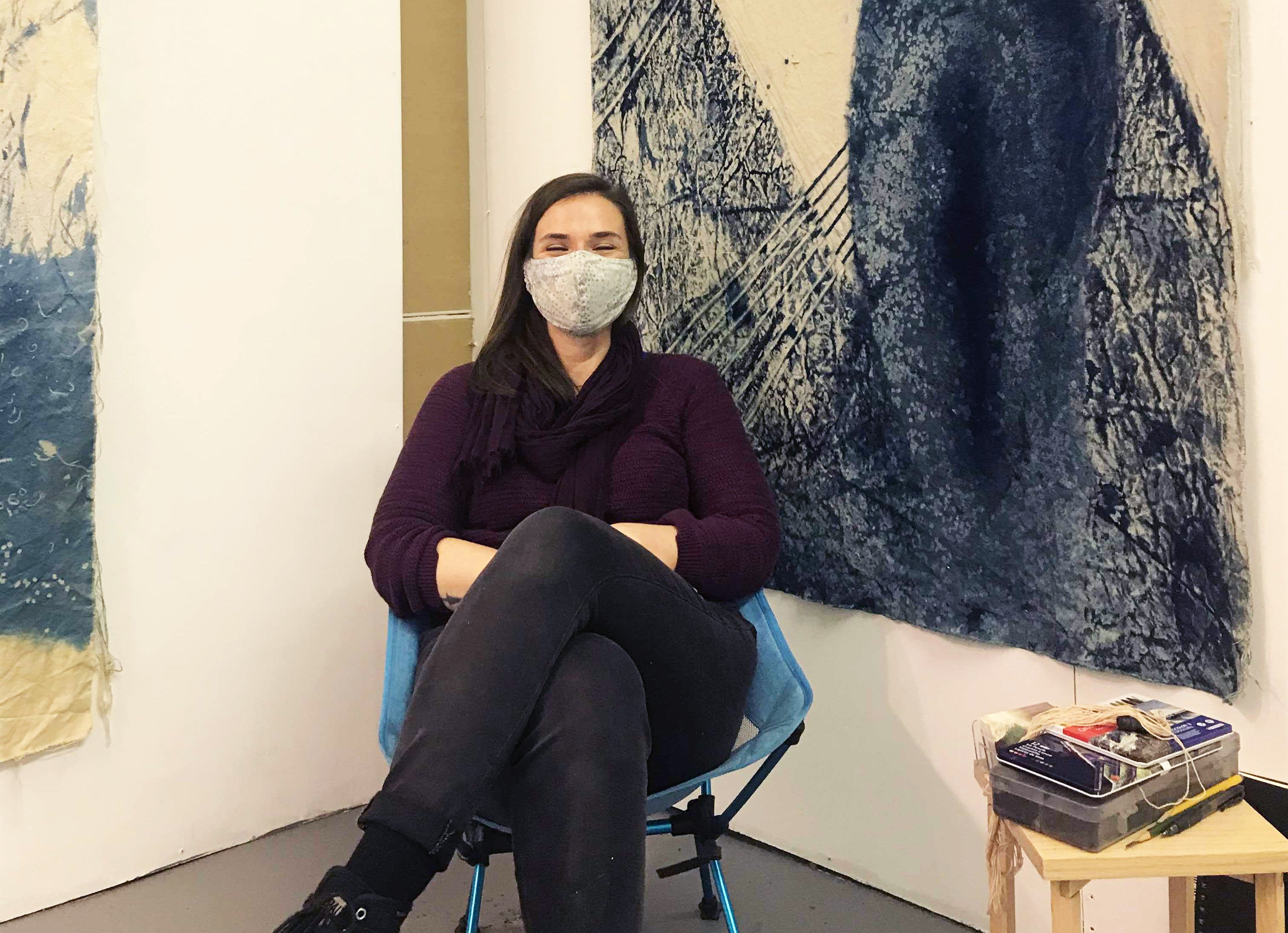 Contemporary artist Johanna Aenderl Ryan sitting in her art studio in Brooklyn, New York 