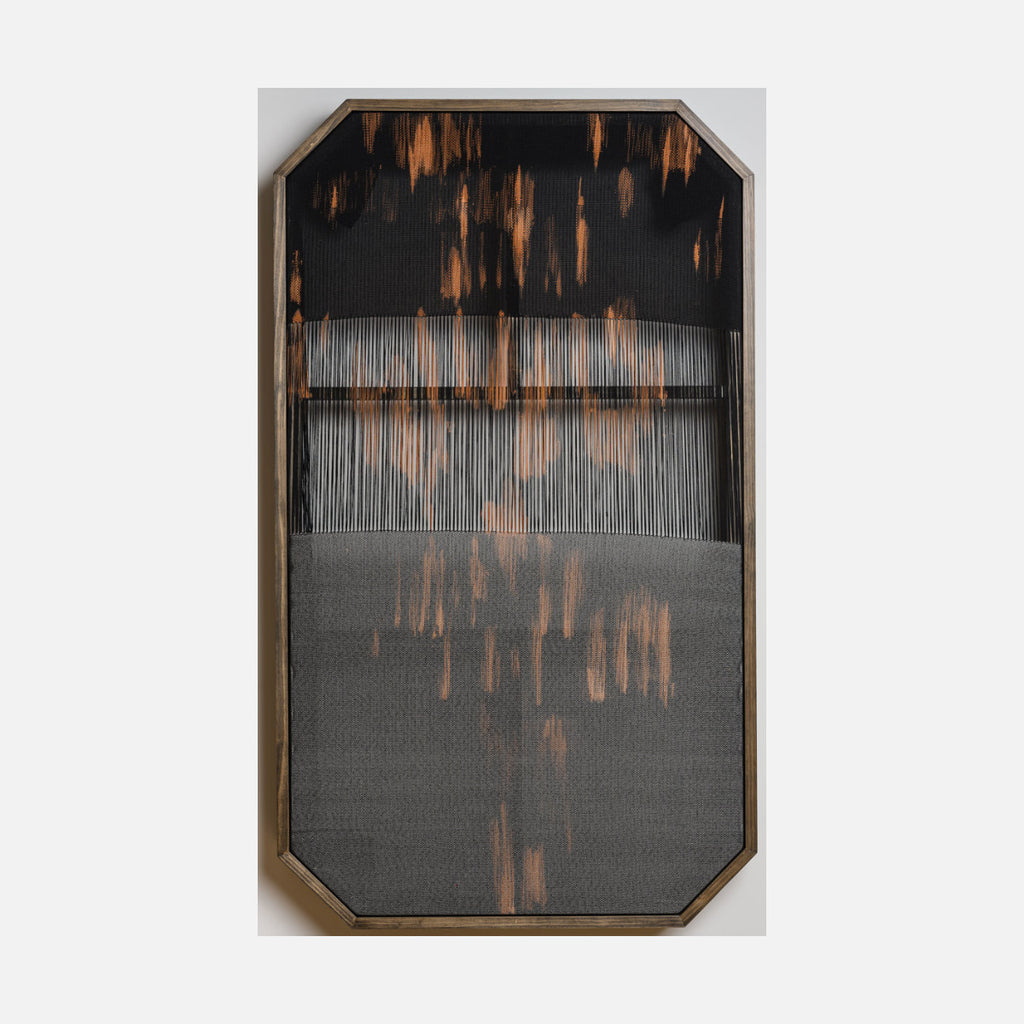 Untitled 106: Abstract woven textile with vertical gray threads and copper streaks on black background, framed in gold by Victoria Manganiello