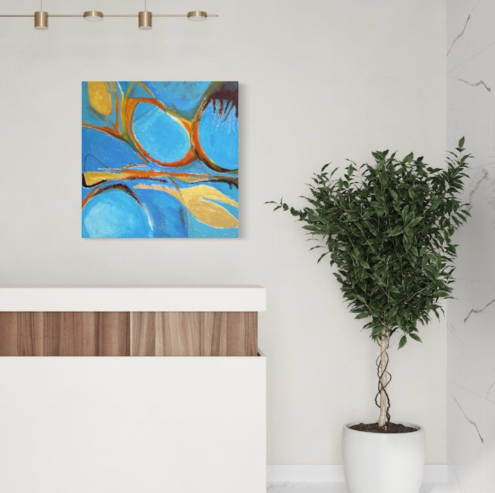 The artwork 'Claw' features bold organic curves in vibrant orange and gold interweaving across a bright azure blue background. Abstract flowing lines create a dynamic composition reminiscent of natural forms. The 36x36 inch acrylic painting on canvas showcases fluid brushwork and contrasting warm and cool tones. By Beth Barry.