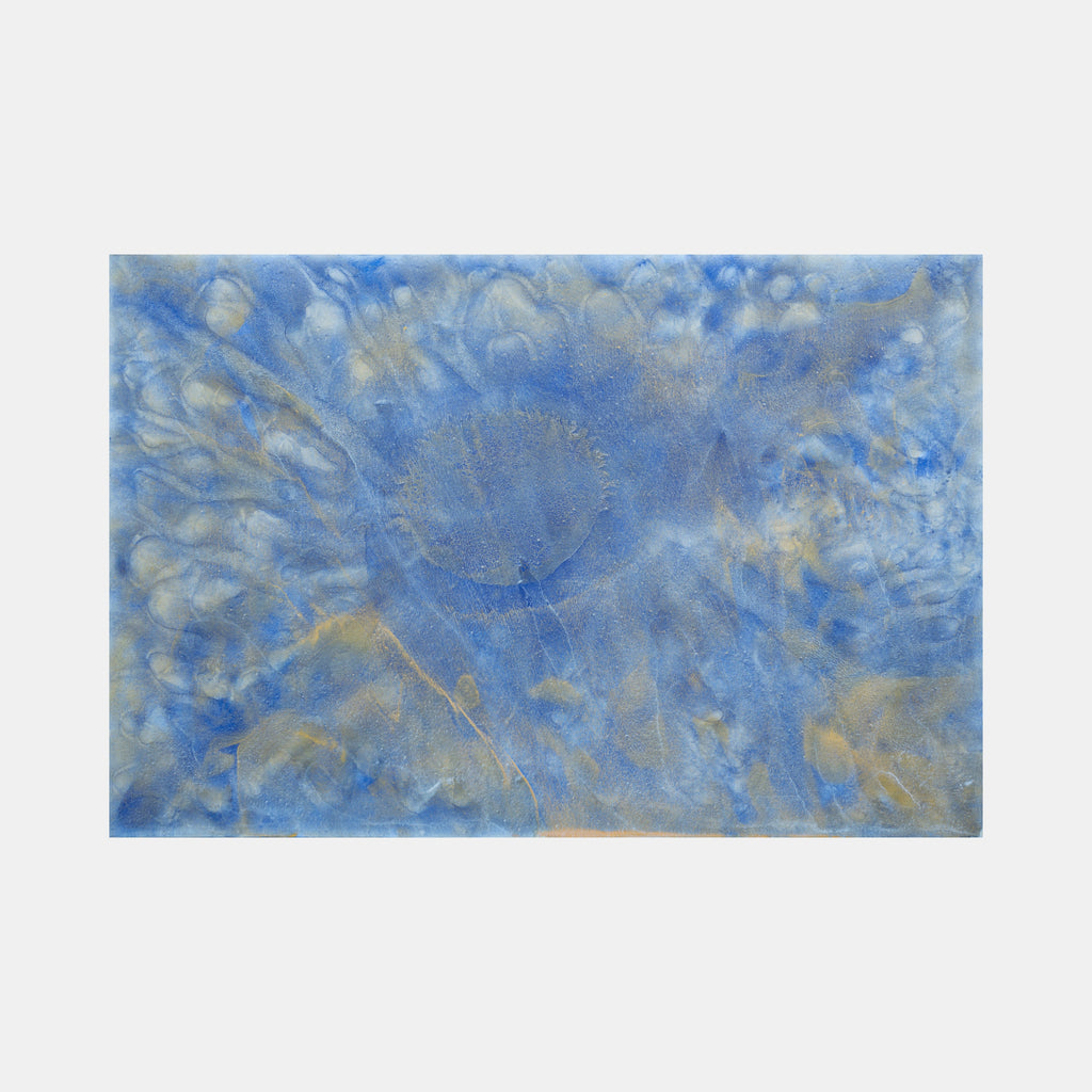 The artwork 'Biophilia 23' by George Stanojevic features ethereal blue and silver tones swirling across canvas, creating an atmospheric abstract composition. Natural elements blend to form cloudy textures and organic patterns, with golden undertones emerging through layers of azure pigment, showcasing the influence of sunlight and water on the medium.