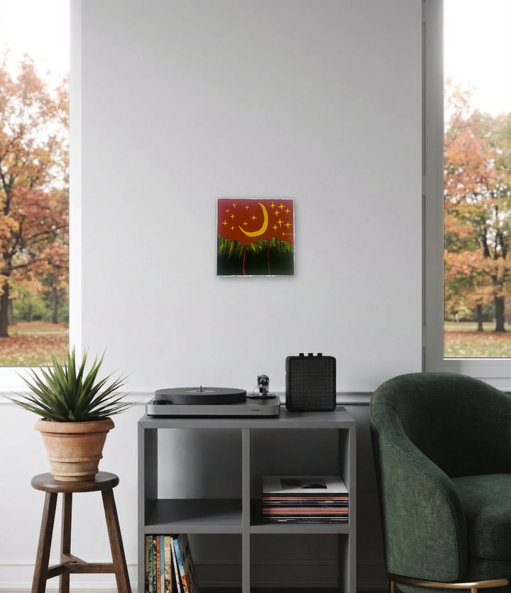 The artwork, Buttes Under The Stars, by Sunny Chapman, displayed in a room.