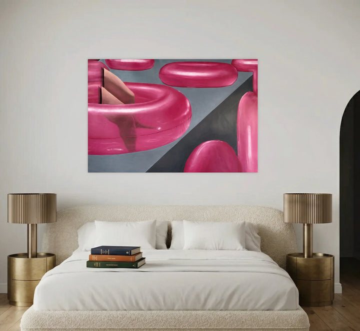 Almost Gone by Anastasia Korsakova depicts glossy, oversized pink rings suspended over a sleek, geometric gray background, creating an intriguing abstract composition that blends modern form and spatial contrast with a polished, contemporary aesthetic.