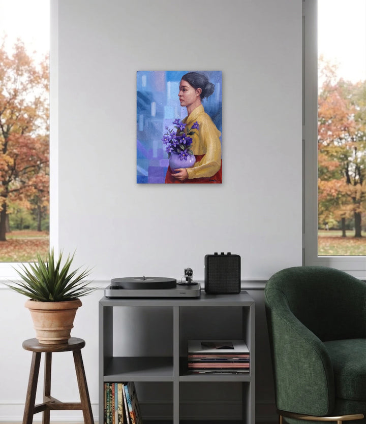 I came here with my dream by Eun Young Yun depicts a thoughtful woman in profile wearing a golden garment, holding a lavender vase filled with vibrant purple flowers, set against a softly textured blue and purple abstract background, blending classical portraiture with modern art.