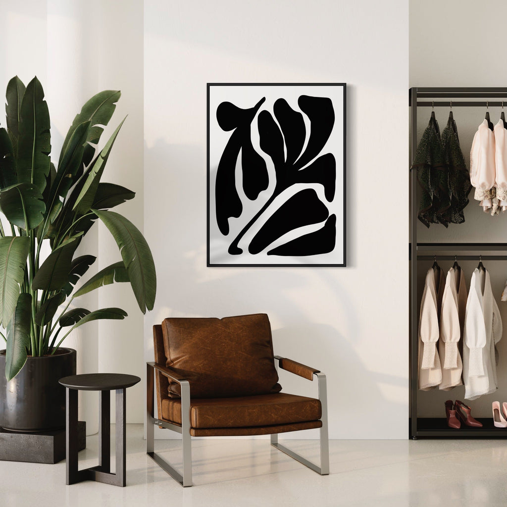 The artwork 'Flores Graphics Various' by Alina Glotova features bold abstract black organic shapes on white background, creating a striking minimalist composition. The design suggests flowing botanical forms with curved lines and dynamic negative space. Modern print measures 40x30 inches, perfect for contemporary interior spaces. By Alina Glotova.