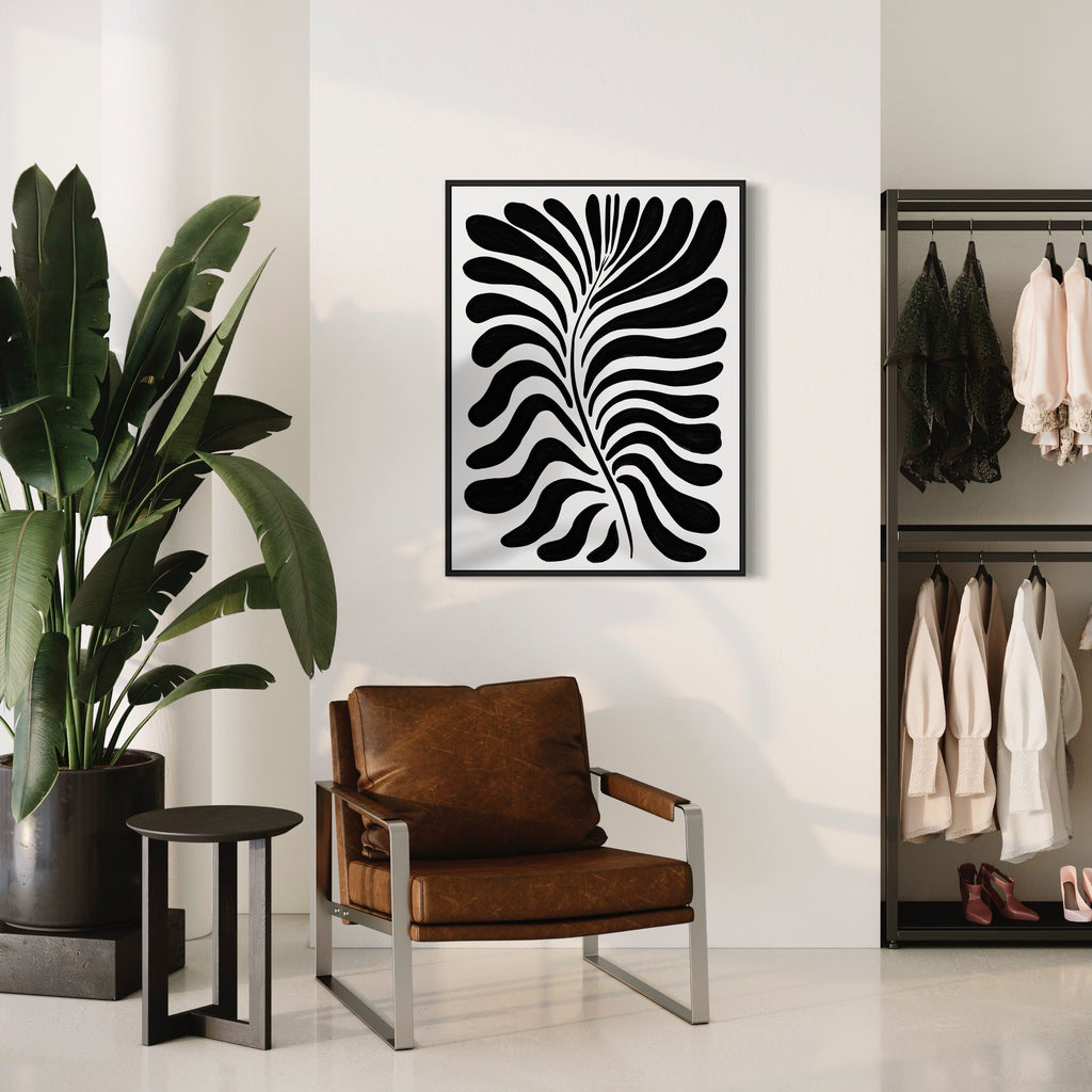 The artwork 'Flores Graphics' by Alina Glotova features a bold black and white abstract print with dynamic curved stripes forming a mesmerizing leaf-like pattern. The modern minimalist design showcases fluid lines creating a striking optical illusion effect against a white background. The 40x30 inch unframed print offers sophisticated geometric artistry.