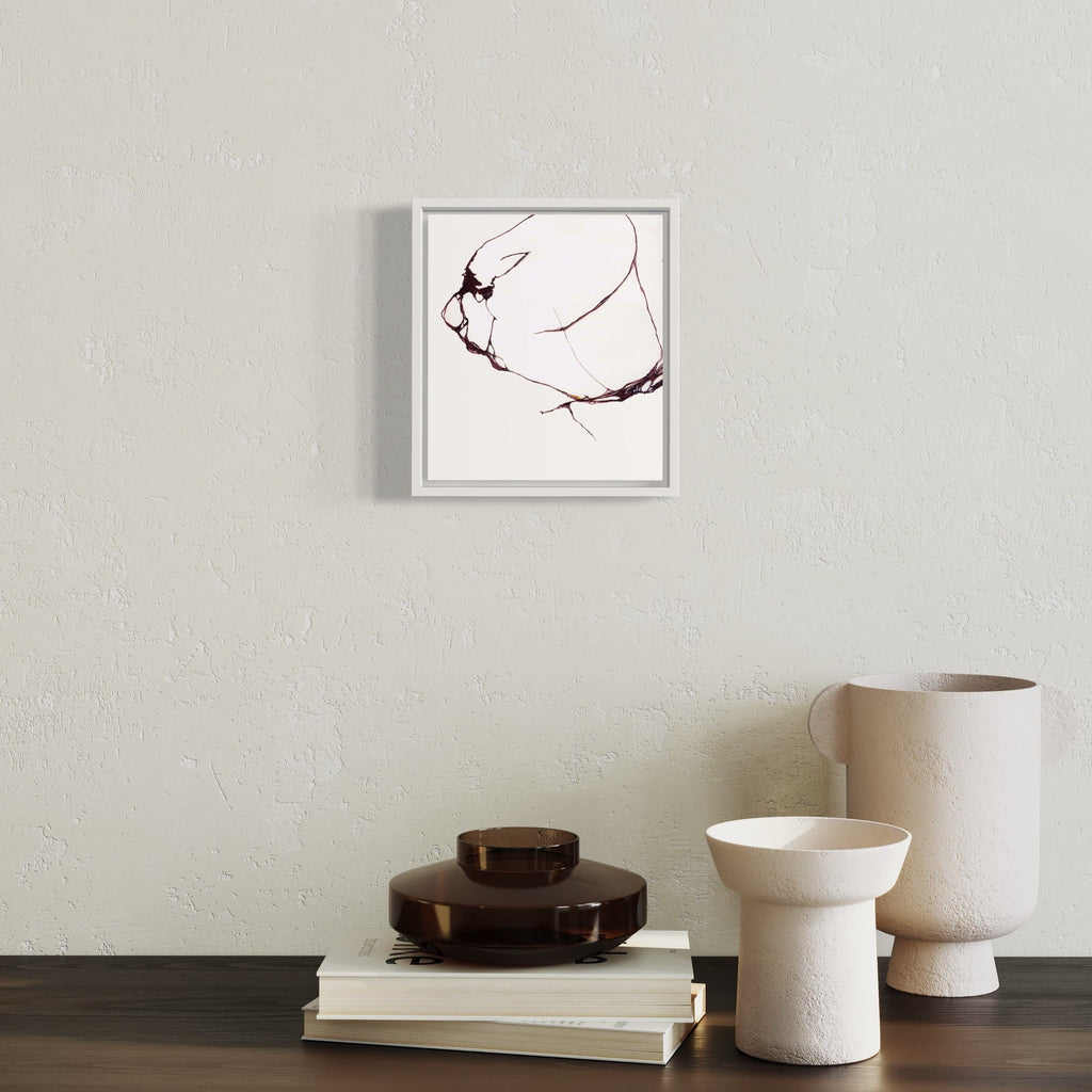 The artwork 'Todo a' by Susan Rowe Harrison features delicate black ink lines on white paper creating an abstract, minimalist composition. The flowing curves suggest organic movement, with thin, graceful strokes dancing across the surface. The piece, framed in white, measures 9.5 x 10.75 inches and demonstrates a sophisticated interplay between negative space and linear elements. By Susan Rowe Harrison.
