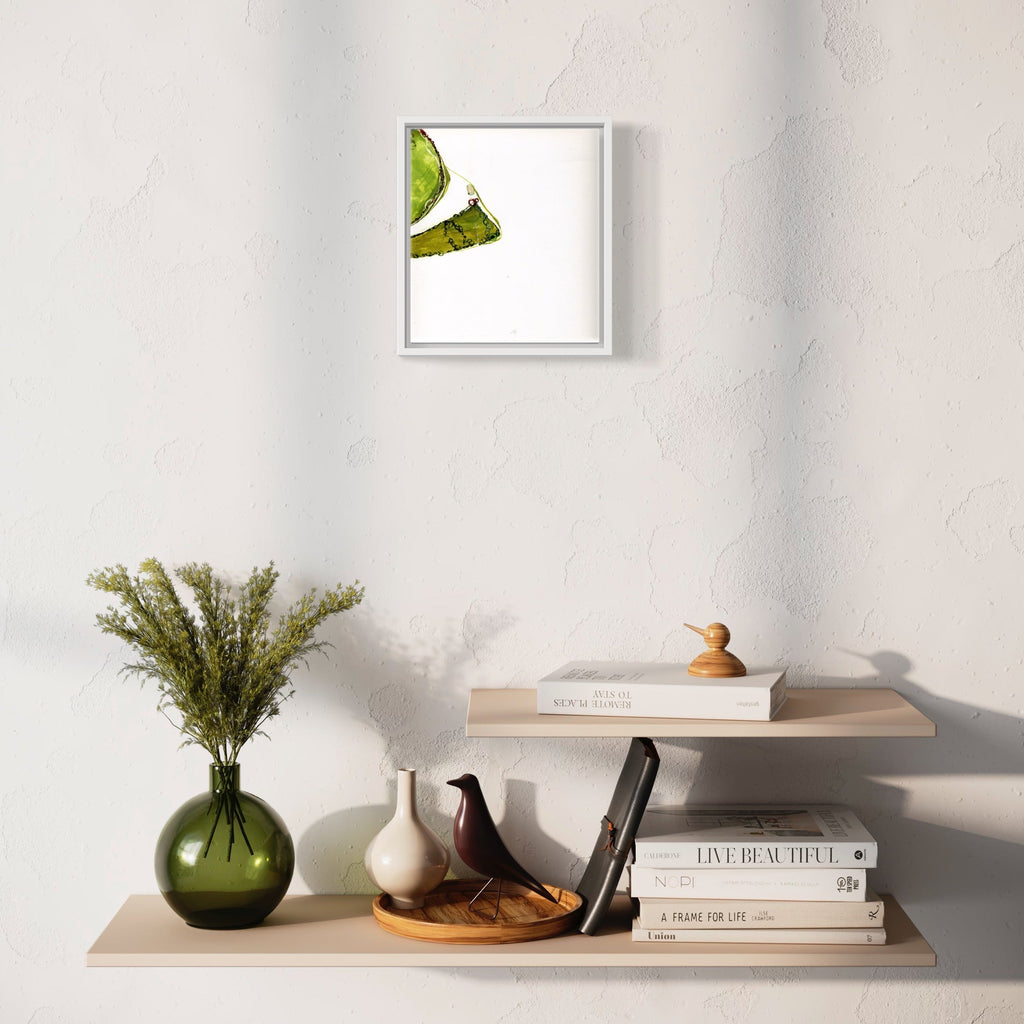 The artwork 'Don't panic 401/4' by Susan Rowe Harrison features a minimalist ink drawing on white paper showing a delicate green organic form, seemingly floating in negative space. The piece is presented in a clean white frame, capturing a sense of lightness and movement through simple, elegant lines - by Susan Rowe Harrison.