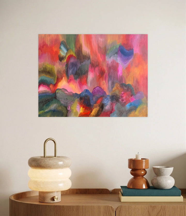 Taking Chances by Kim Rosebud reveals a vibrant abstract landscape with flowing brushstrokes in warm reds, pinks, and oranges mixed with cool blues and greens, creating a dynamic interplay of color and texture that adds lively energy to contemporary art collections.