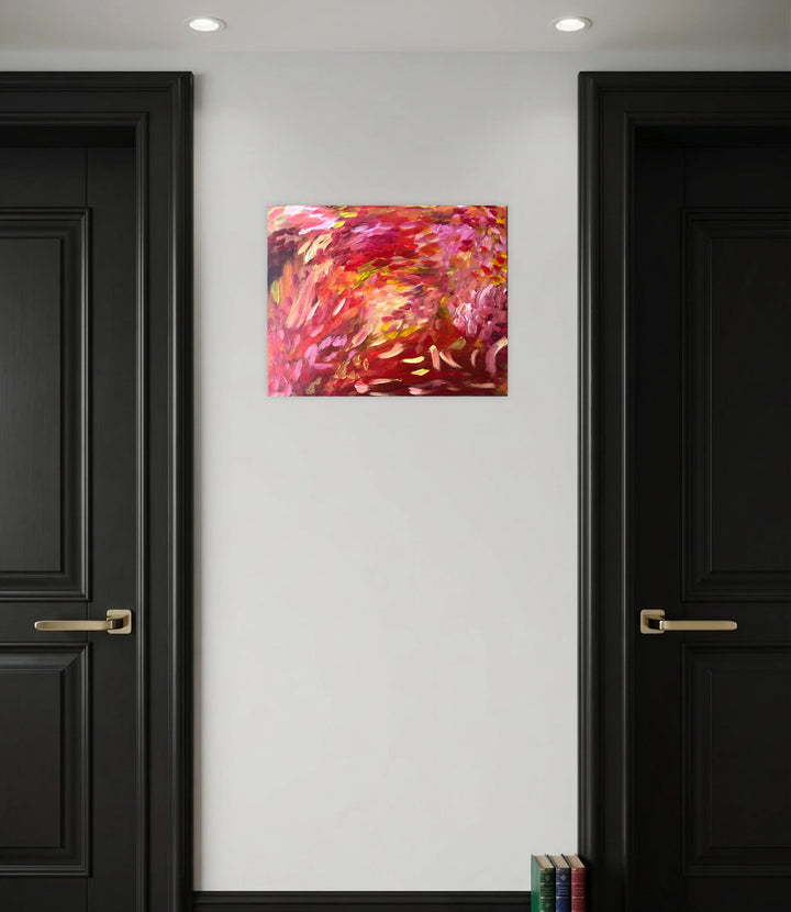 There is a Light by Kim Rosebud radiates warmth through vivid reds, pinks, and golds with expressive brushstrokes, creating an abstract composition that instills vibrant energy and uplifting ambiance to contemporary art collections.