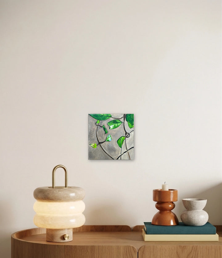 The artwork, Let the Soil Dry Out Before Watering., by Jessica Preble, displayed in a room.