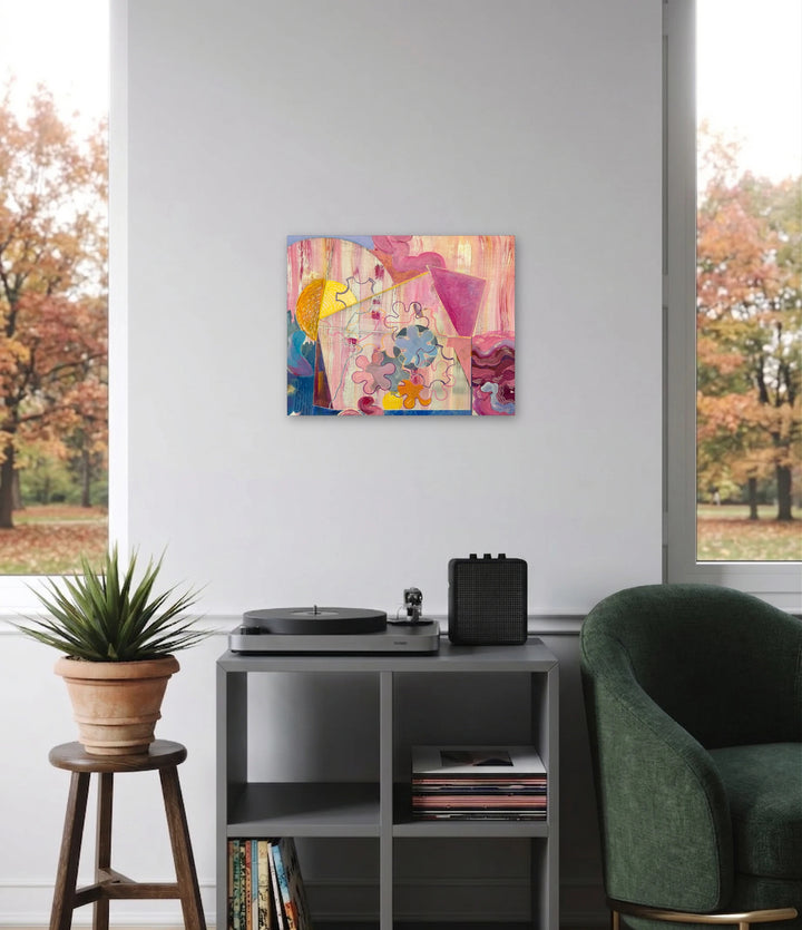 Out of the Box: Spin by Jane Dell features a lively abstract design with warm pinks, purples, and yellows, combining playful organic shapes and soft geometric forms to create an inviting, contemporary art piece in a cozy modern living space.