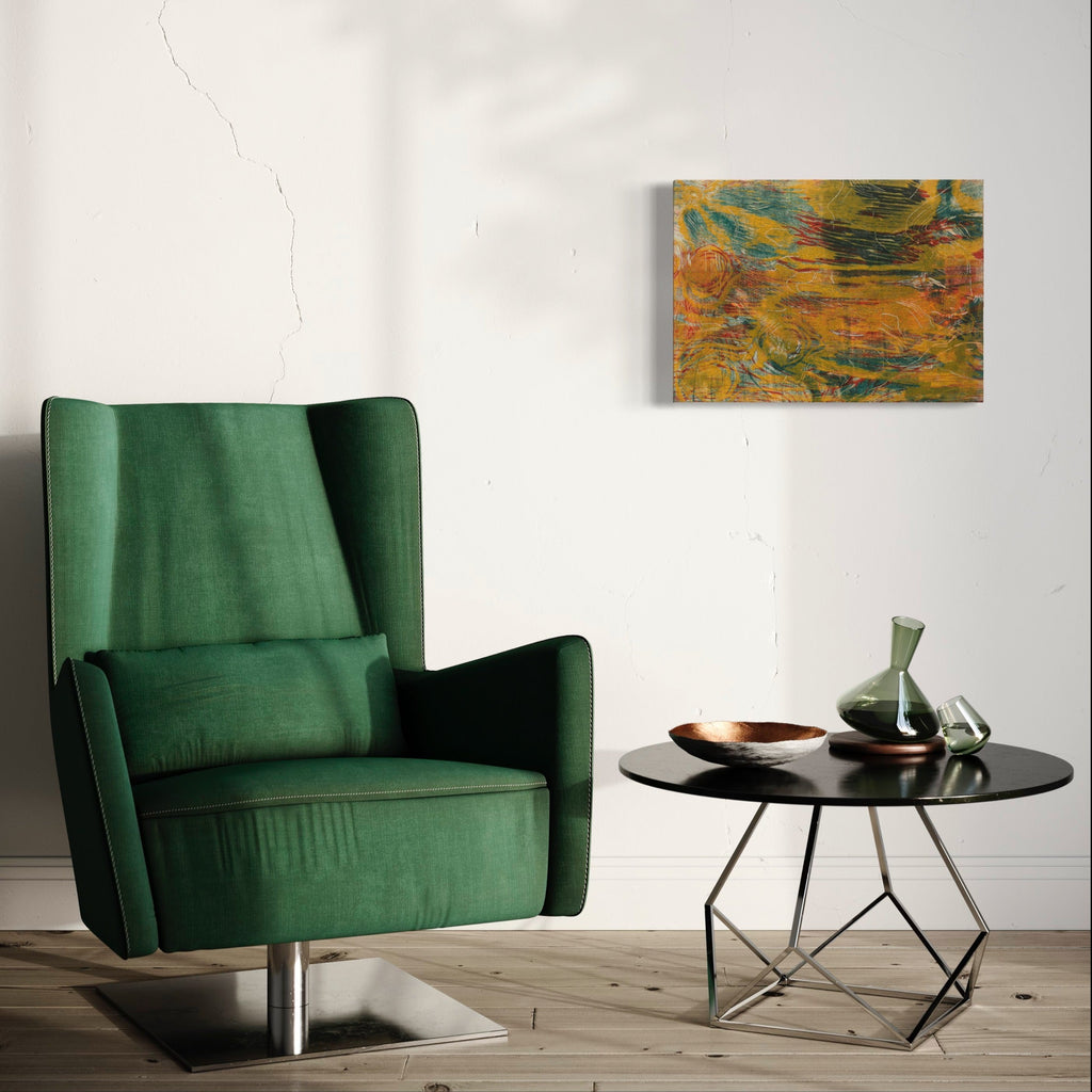 The artwork 'Dark Pond' by Emna Zghal features swirling patterns of deep orange, teal, and golden hues created through woodcut printing techniques. Abstract organic forms suggest rippling water reflections, with layered ink textures on paper mounted to canvas. The dynamic composition measures 18x25 inches and displays rich contrasts between dark and luminous areas.
