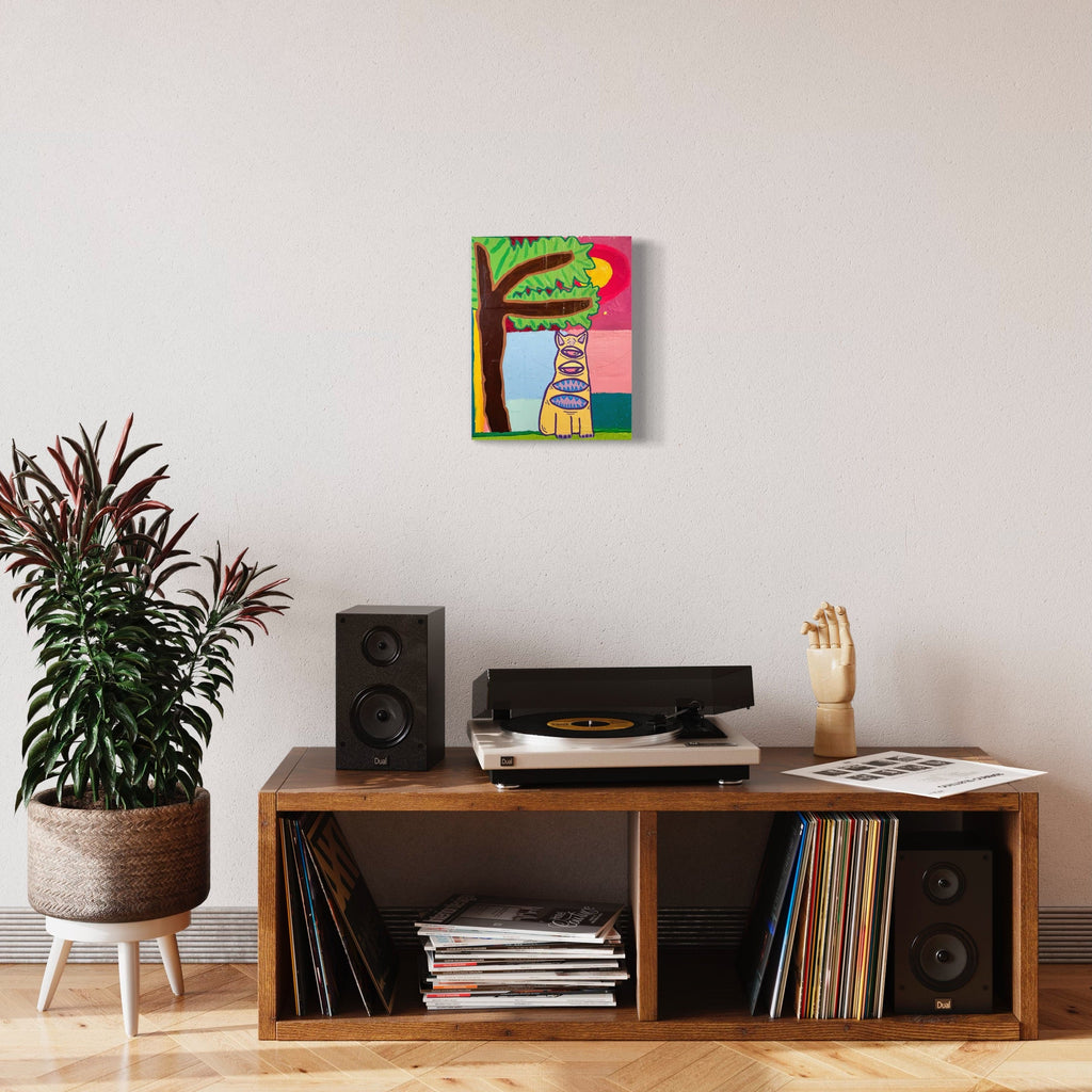 The artwork 'Tapir, from somewhere else' by Brandon Hodges features a whimsical tapir rendered in vibrant colors against a divided background of pink and green sections. The modern, naive-style painting showcases bold outlines and geometric shapes, created with acrylic paint and acrylic pen on stretched cotton canvas, measuring 14 x 11 inches.
