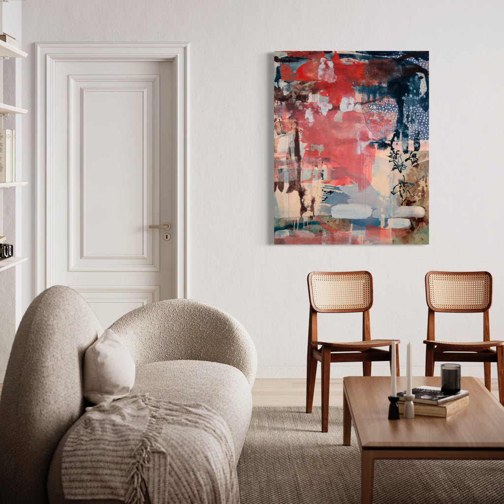 The artwork 'Mallow Rose' by Molly Herman features an abstract composition with dynamic coral and blue hues layered in expressive brushstrokes. The mixed-media piece combines acrylic, oil, and batik collage elements creating textural depth and movement across the canvas. Gentle beige undertones balance the bold color palette, while gestural marks and overlapping forms create a sense of depth and atmosphere by Molly Herman.