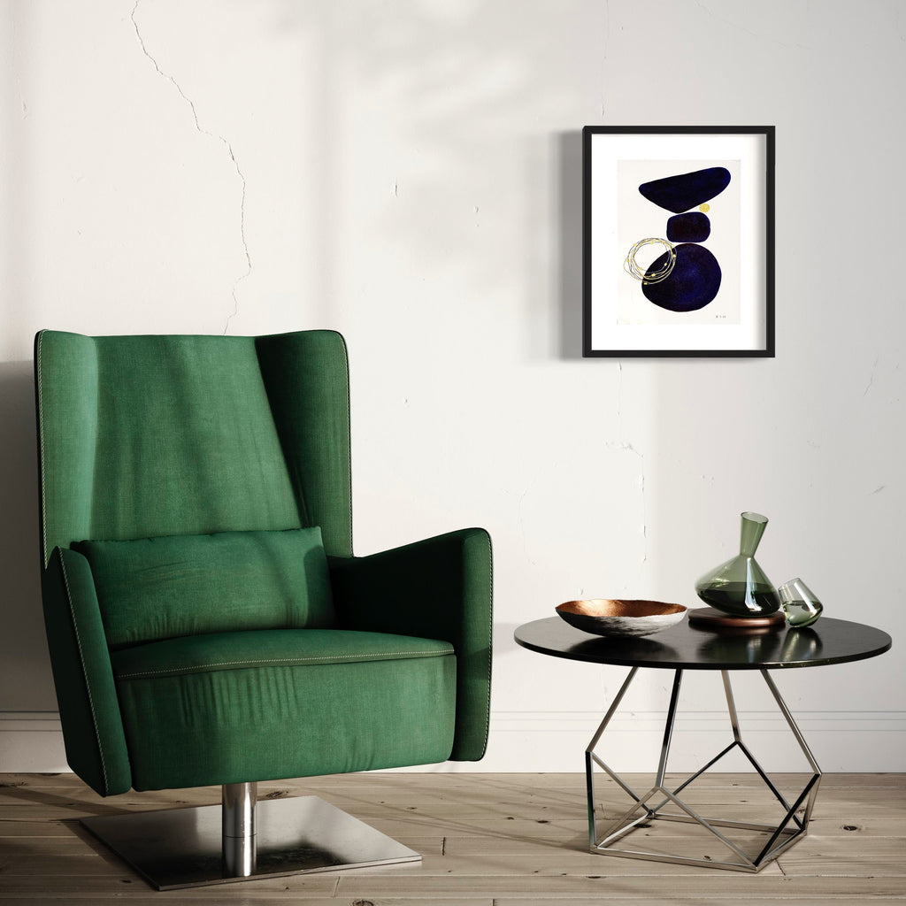 The artwork 'Midnight Balance' by Jocelyn Benford features abstract geometric shapes in deep navy blue, arranged in a balanced composition against white paper. The watercolor and mixed media piece showcases fluid brushstrokes with delicate golden accents, creating a harmonious interplay of organic forms and negative space in a 20x16 inch format.