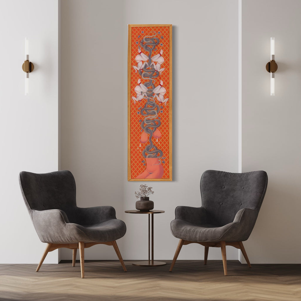 Snake Couture Red Embellished by Chelsea Amato features a striking vertical mixed media collage with symmetrical snake motifs against a vibrant orange latticed background. The serpentine forms in metallic gray create an elegant repeated pattern, bordered by coral-red accents. The 16x60 inch piece combines geometric patterns with organic shapes, creating a luxurious modern design.