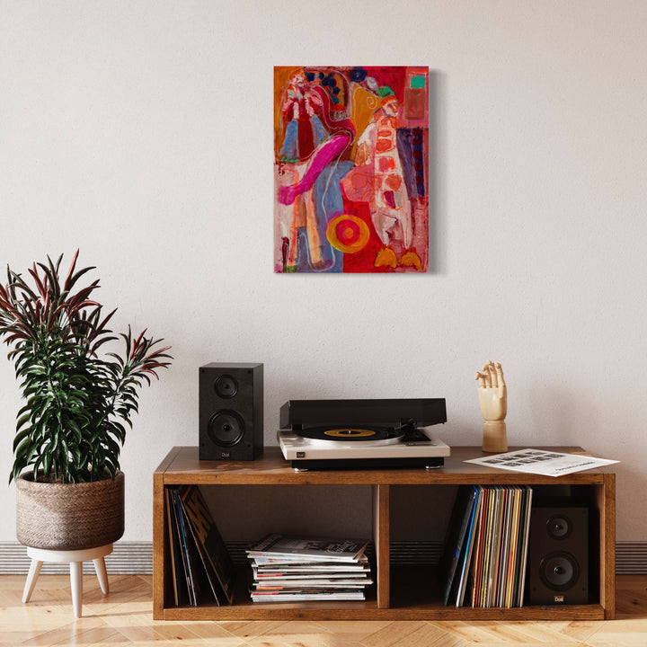 The artwork 'Playing One' by Jennifer Levine features vibrant abstract figures in dynamic poses against a warm orange background. Bold strokes of pink, blue, and red create flowing forms, while playful polka dot patterns add whimsical texture. The acrylic and oil stick technique creates distinct layering and energetic movement on canvas paper, measuring 24x18 inches.