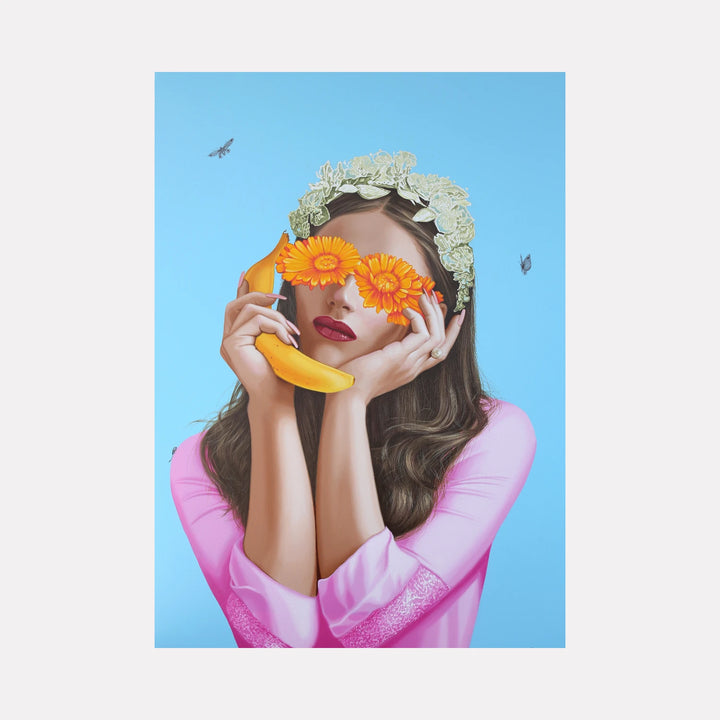 Telephone Talk by Carlos Gamez de Francisco is a Curina art piece portraying a woman in pink with a floral headband, holding a banana like a phone, and orange flowers covering her eyes against a clear blue sky with small insects, blending playful surrealism with delicate natural details.