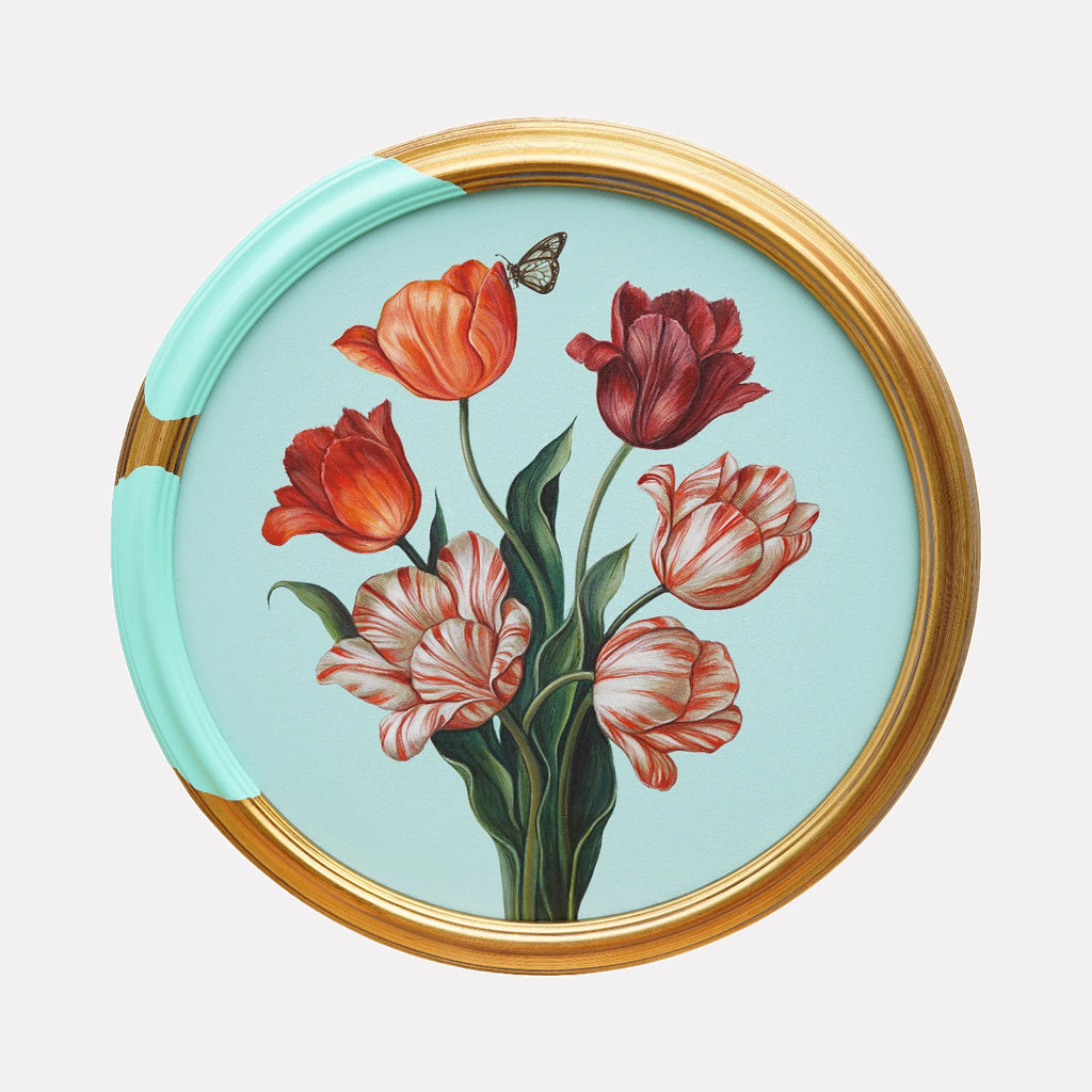 The Butterfly’s Visit I by Carlos Gamez de Francisco is a Curina art piece depicting a bouquet of red and white tulips with detailed green leaves, accompanied by a small butterfly, set against a soft pastel blue background within a circular frame partially accented in light turquoise.