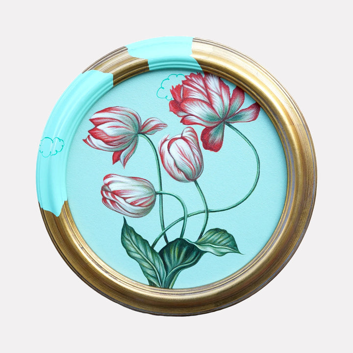 Where the Edges Forget to Stay Edges by Carlos Gamez de Francisco is a Curina art piece featuring delicate red and white tulips with green stems and leaves set against a soft blue background, framed by a circular gold frame partially accented with light blue paint and subtle cloud motifs.