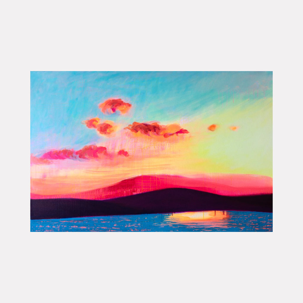Dingle Bay by Melanie Kozol is a Curina art piece capturing a vibrant sunset over silhouetted hills with glowing pink and orange clouds reflected in calm blue waters, blending vivid color contrasts and soft atmospheric effects in a serene coastal landscape.