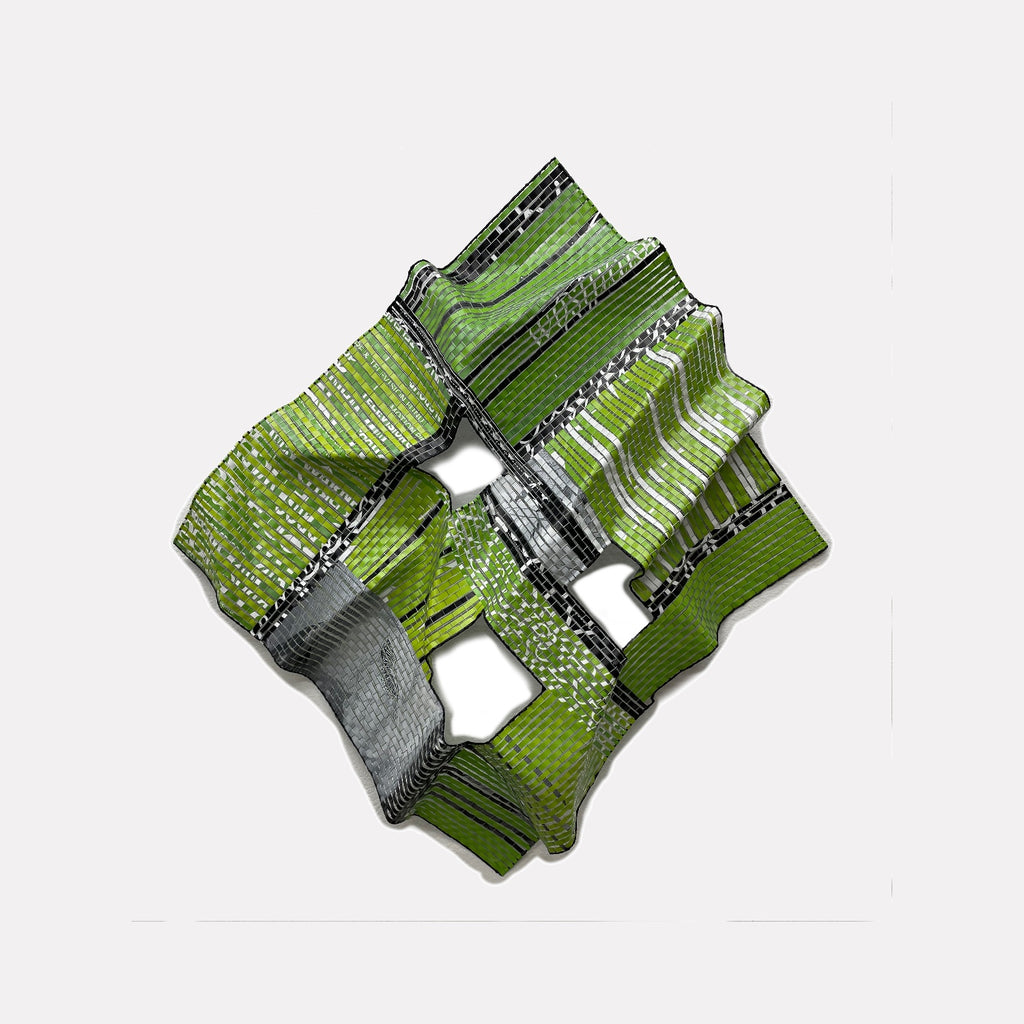 Hudson # 19 by Shelley Heffler is a Curina art piece featuring an intricate, folded metallic sculpture with green, black, and silver striped patterns, creating a textured, geometric form that blends industrial and organic aesthetics in a dynamic, contemporary composition.