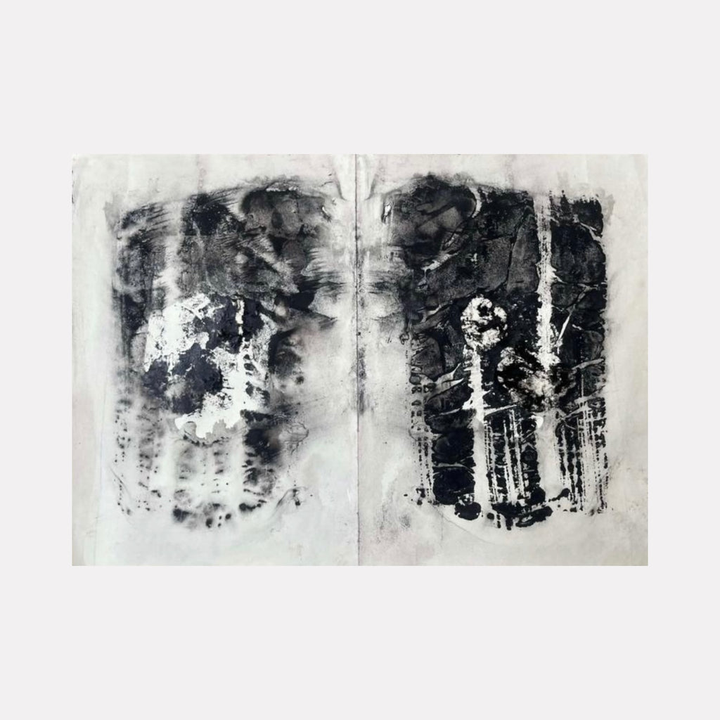 Embryo by Dionysia Adamopoulou is a Curina art piece featuring a monochromatic abstract diptych with textured layers of black and gray, evoking organic forms and subtle contrasts that invite contemplation of emergence and transformation.