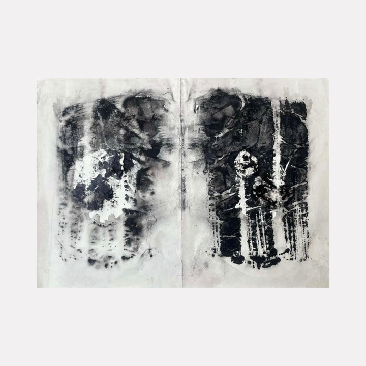 Embryo by Dionysia Adamopoulou is a Curina art piece featuring a monochromatic abstract diptych with textured layers of black and gray, evoking organic forms and subtle contrasts that invite contemplation of emergence and transformation.