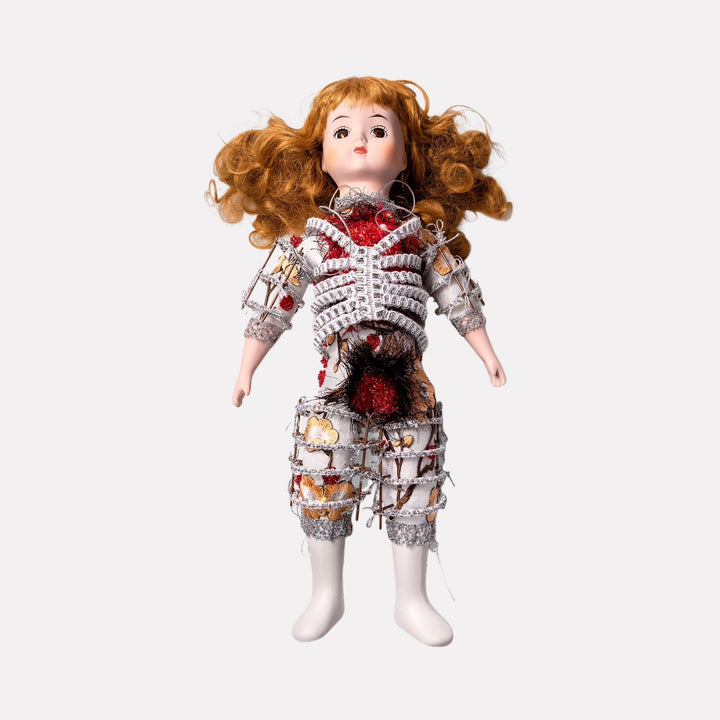 Little Red Miracle by Lisyanet Rodriguez presents a handcrafted doll with curly auburn hair dressed in an intricate, textured outfit combining fabric and wire elements in muted tones, showcasing a unique artistic collectible crafted with thoughtful detail for Curina art.