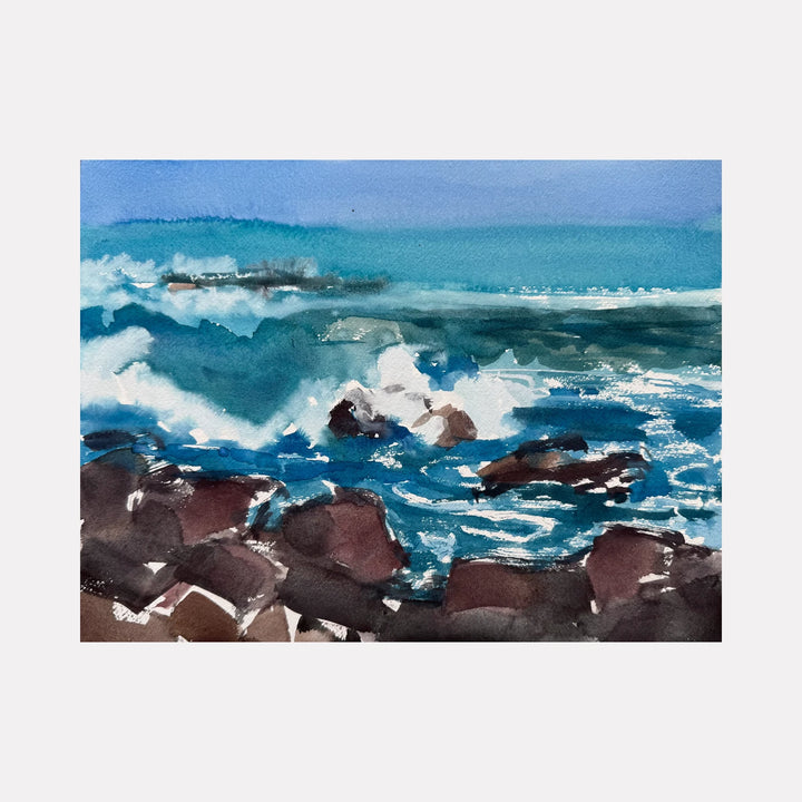 Rocky Shore by Melanie Kozol is a Curina art piece capturing turbulent waves crashing against dark rocky formations, with deep blues and foamy whites blending into a dynamic seascape that conveys the raw energy and natural beauty of a rugged coastline.