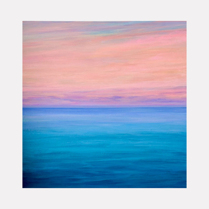 Perfect Ending by Benna Holden is a Curina art piece portraying a tranquil seascape with smooth gradations of deep turquoise to soft blue water beneath a pastel pink and peach sky, evoking a peaceful, calming atmosphere in a refined acrylic style.