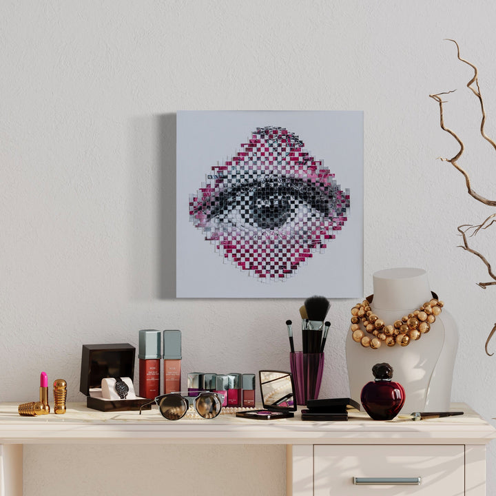 The artwork 'Pink Leaves' by Kiana Honarmand features an intricate pixelated eye design, rendered in a mosaic-like pattern using hand-cut and woven digital prints. The composition blends soft pink and gray tones in a diamond-shaped arrangement, creating a mesmerizing 16x16 inch contemporary wall piece that combines digital art with handcrafted elements. By Kiana Honarmand.