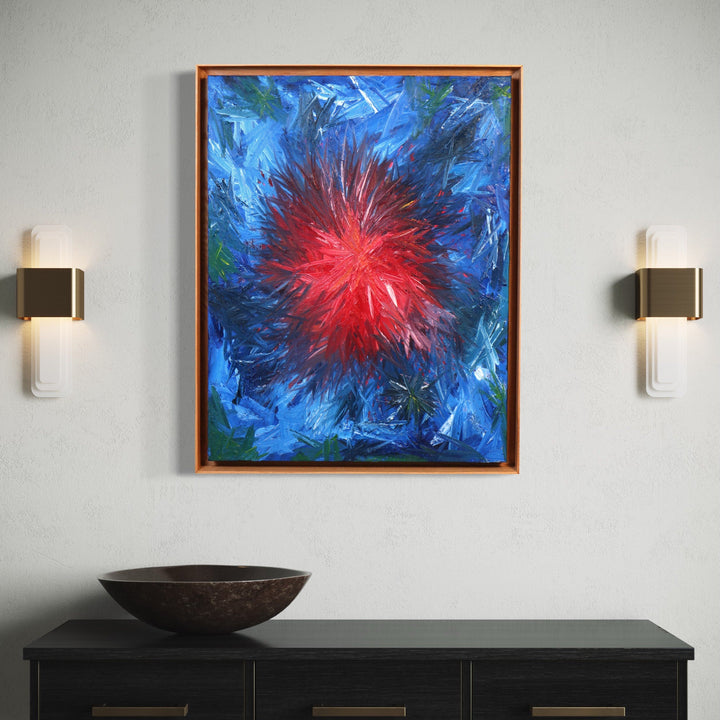 The artwork 'Rising 3' by Bill Burns features a vibrant abstract composition with an explosive red burst radiating from the center, surrounded by dynamic strokes of deep blue and touches of green. The oil painting creates a dramatic cosmic effect with textured brushwork and energetic movement, framed in warm wood on canvas, 30x24 inches.