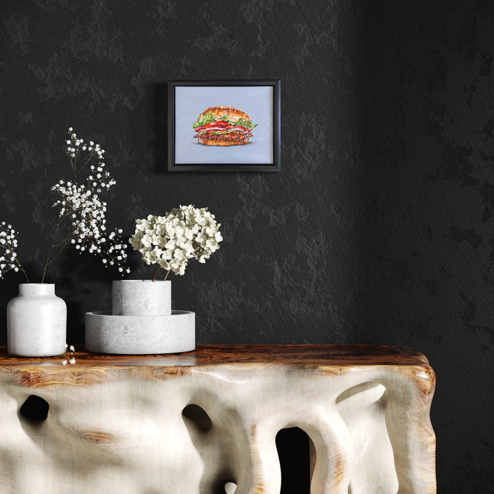 A photo of the artwork THIS 'BURGER' IS 'KING', by Shweta Matai, hanging on a wall.