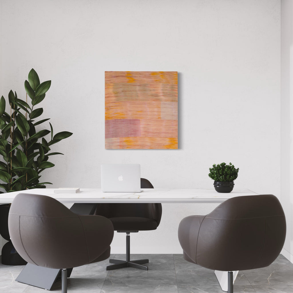 The artwork 'Untitled 101' by Victoria Manganiello features a minimalist abstract composition with soft peach and orange tones blending across a square canvas. Horizontal brushstrokes create a subtle layered effect, with gentle yellow accents adding warmth and depth. The natural and synthetic fibers create a textural surface that catches light, measuring 32 by 30 inches.