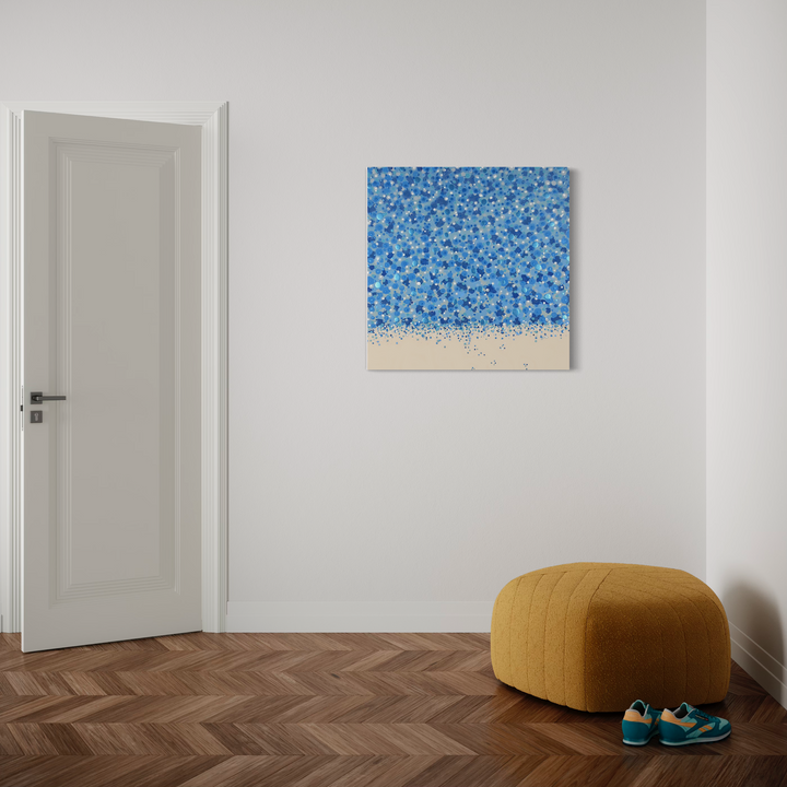 The artwork 'Cascade' by Eric Jiaju Lee features a mesmerizing pointillist composition with scattered blue dots creating a waterfall-like effect against a natural canvas base. The abstract acrylic painting showcases varying shades of azure and cerulean in a dense pattern that gradually disperses toward the bottom, measuring 36 x 36 inches on canvas by Eric Jiaju Lee.