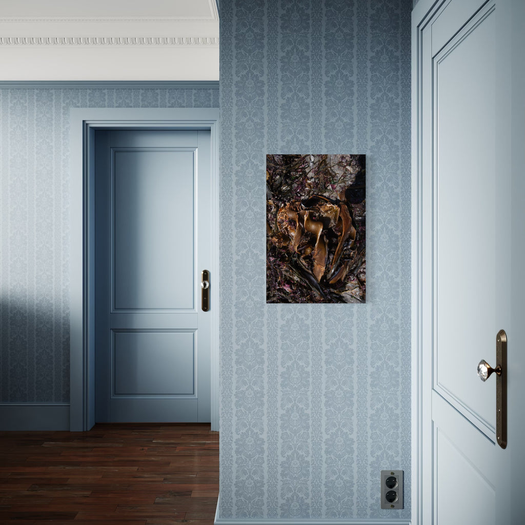 080A6081 by Eunice Pais depicts a dark, textured composition with layered organic shapes and warm metallic accents. Hung on a soft blue patterned wall between two classic doors, the artwork introduces a rich, intriguing contrast that enhances the elegant, vintage-inspired interior.