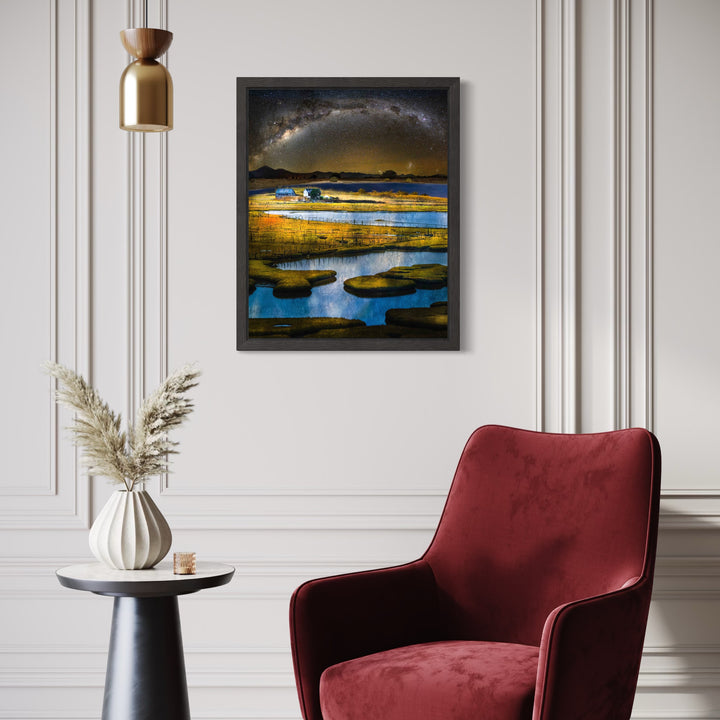Stand #4 by Gordon Saperia depicts a reflective wetland under a shimmering night sky arching with stars, combining deep blues and warm golden tones to evoke a peaceful, expansive natural scene in Curina art style.