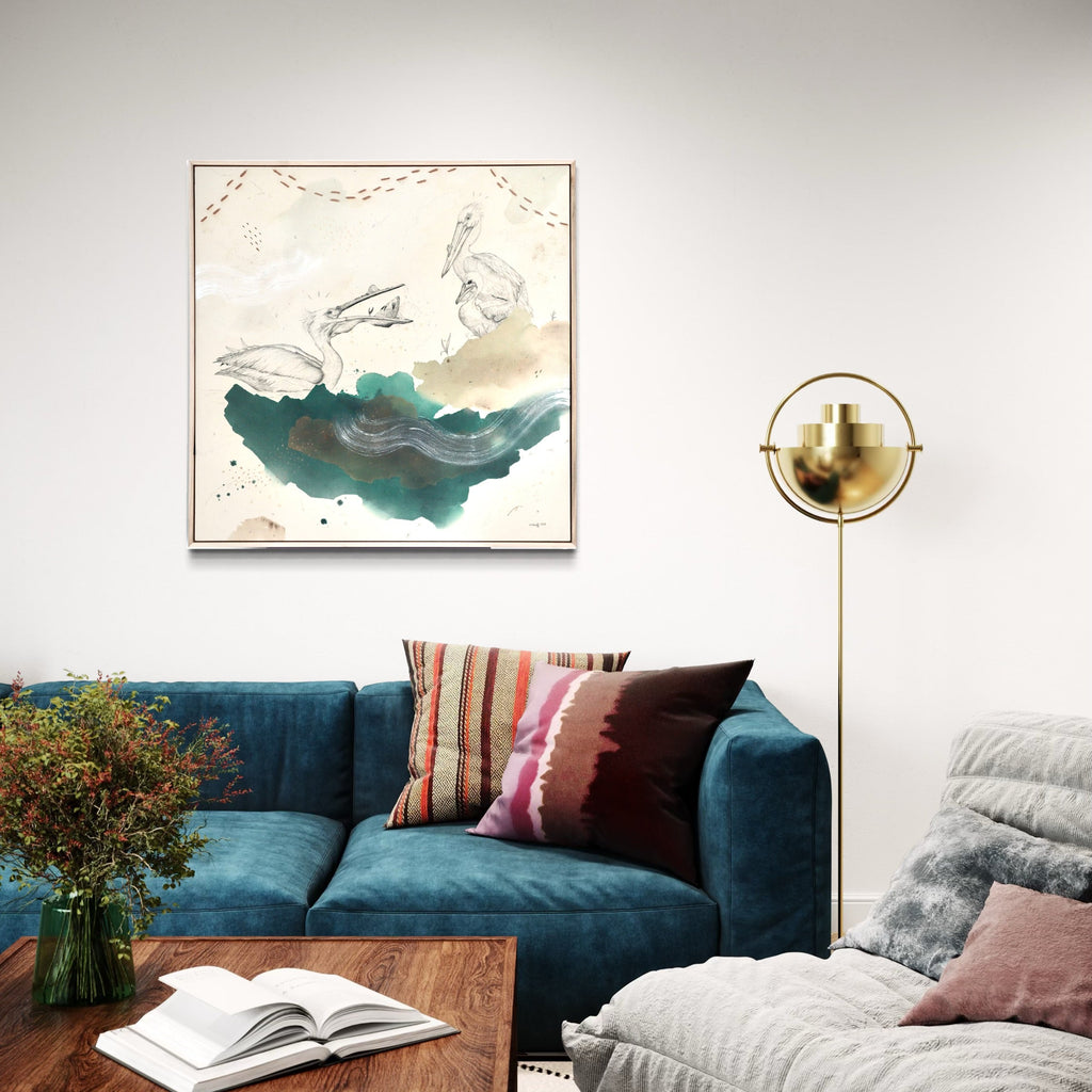 The artwork, American White Pelican Has the Scoop, by Alicia Hauff, displayed in a room.