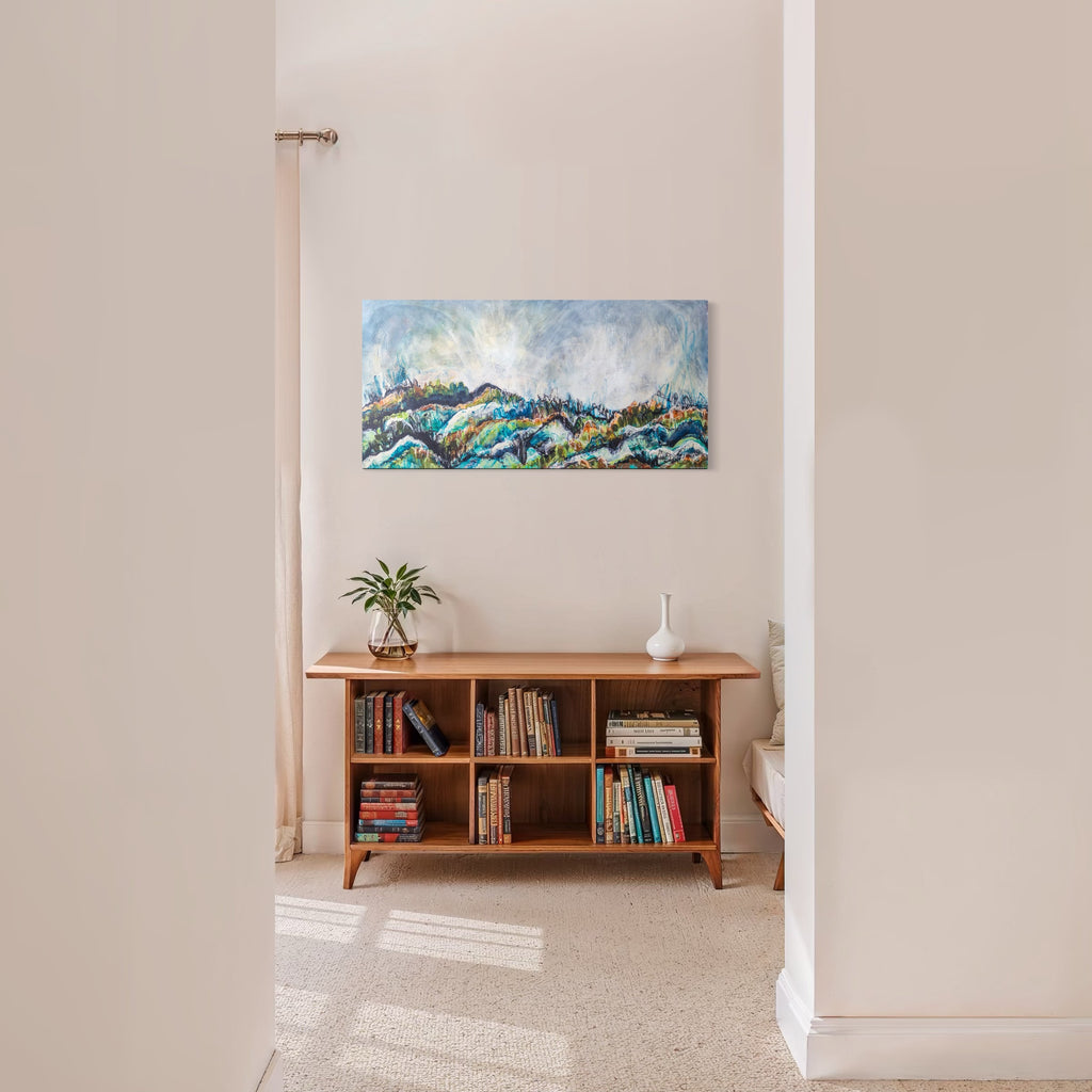 The artwork, Bike Ride, by Betsy Becher, displayed in a room.