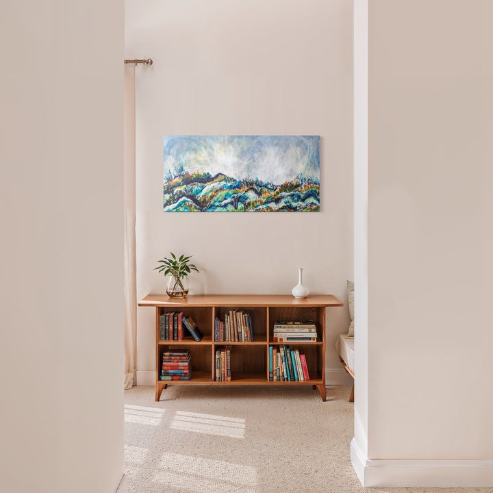 The artwork, Bike Ride, by Betsy Becher, displayed in a room.