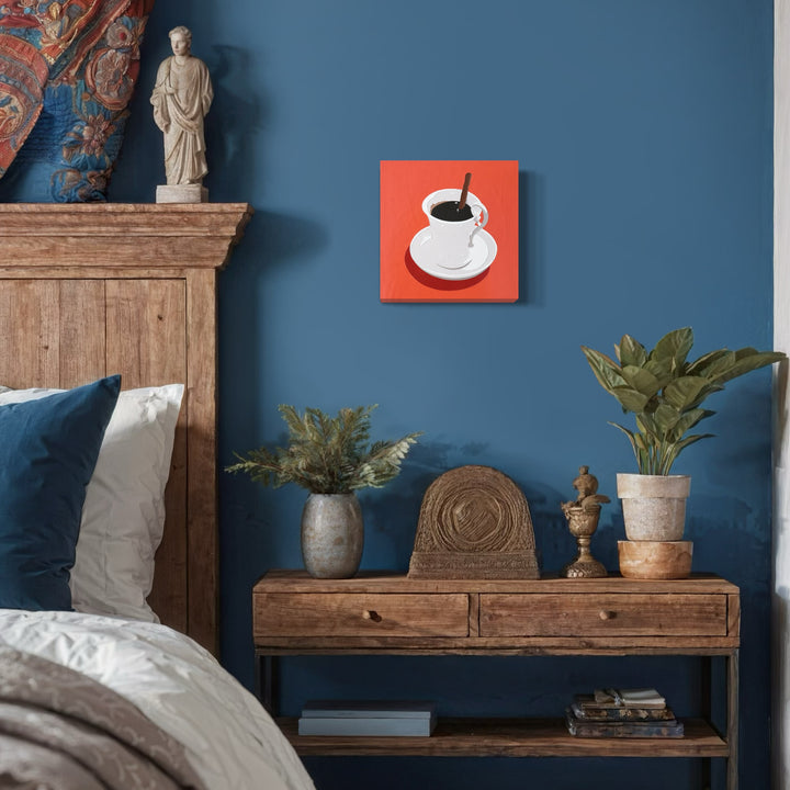 The artwork 'Black Coffee 14' by Lori Larusso features a minimalist composition of a white coffee cup with black liquid on a vibrant coral-red square background. The acrylic and enamel painting on wood panel employs bold, clean lines and a pop art style, creating striking contrast through its simple yet impactful design. - Lori Larusso