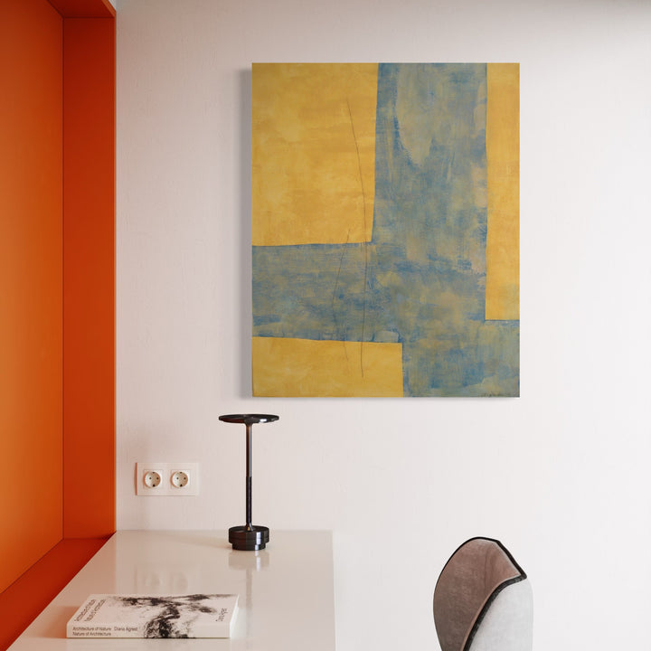 The artwork, Blues on Yellow XXIII, by Diane Englander, displayed in a room.