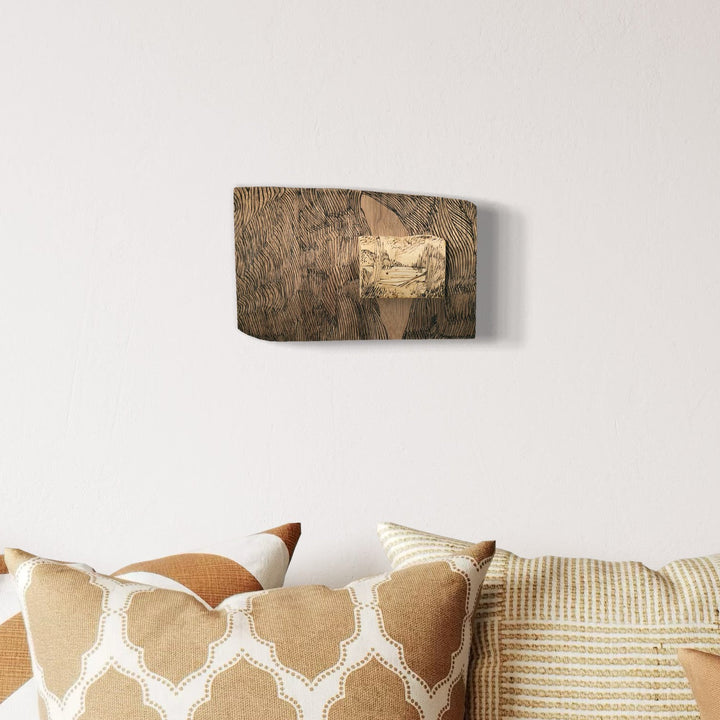 A photo of the artwork Burnt Offering - Deer Hill Bog, by Zoe Cohen, hanging on a wall.
