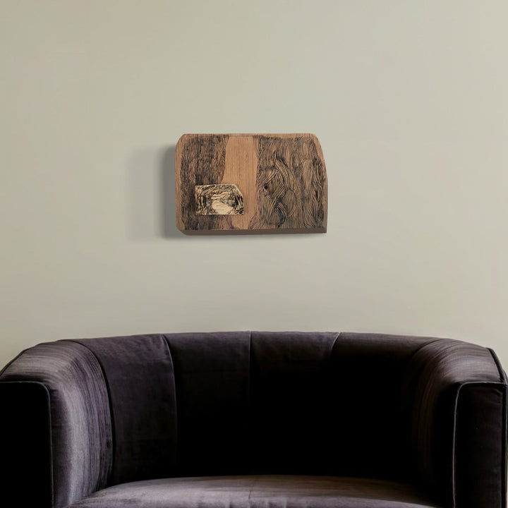 A photo of the artwork Burnt Offering - Mullica River, by Zoe Cohen, hanging on a wall.